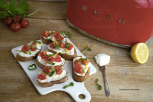 Bruschetta-with-Whipped-Feta,-Tomato,-Basil-and-Lemon-Zest