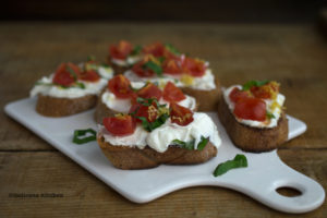 Bruschetta-with-Whipped-Feta,-Tomato,-Basil-and-Lemon-Zest